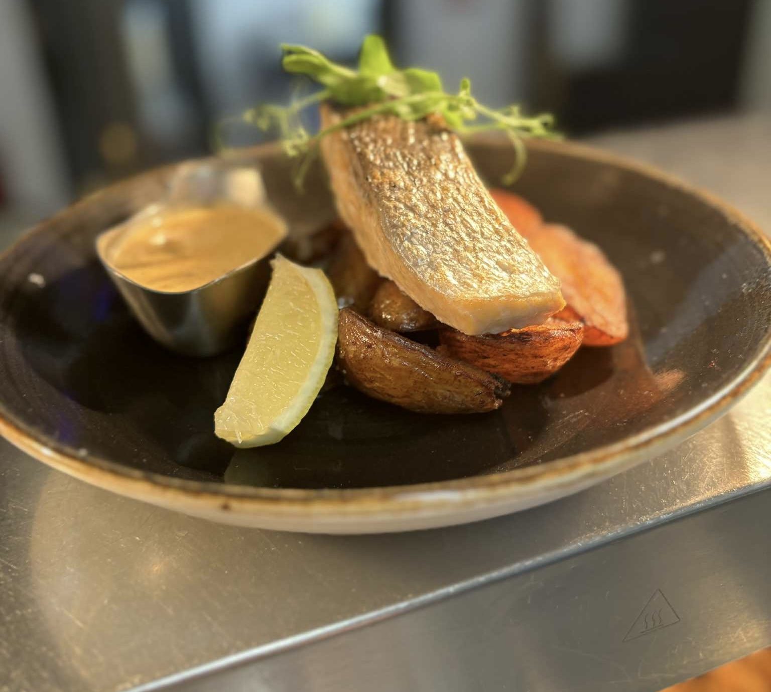 Seared salmon with baby potatoes and lemon
